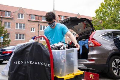 Students moving in for the start of the 2020 fall semester wore masks and arrived in scheduled time blocks to comply with COVID-19 mitigation efforts.
