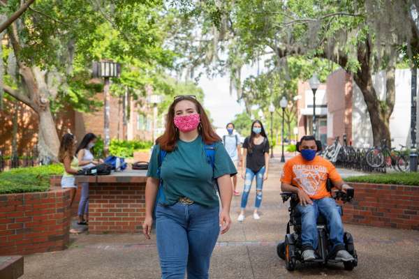 Image: Students on campus, masked and social distancing